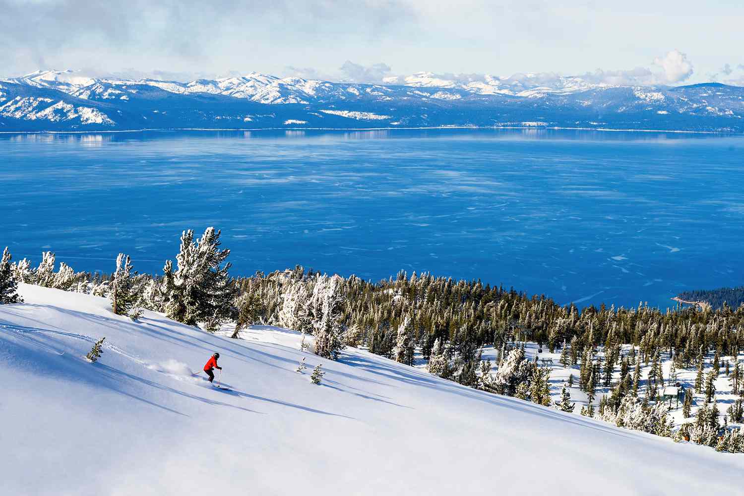 Skiers enjoying a sunny day on the slopes of Lake Tahoe