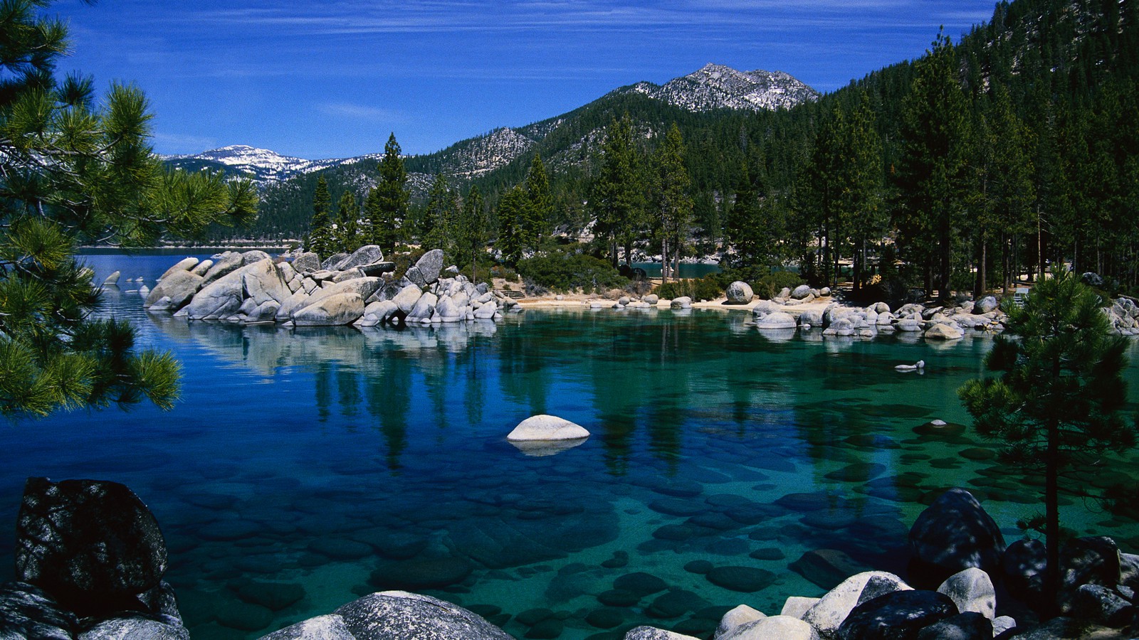 Breathtaking view of Lake Tahoe\'s pristine blue waters and towering mountains