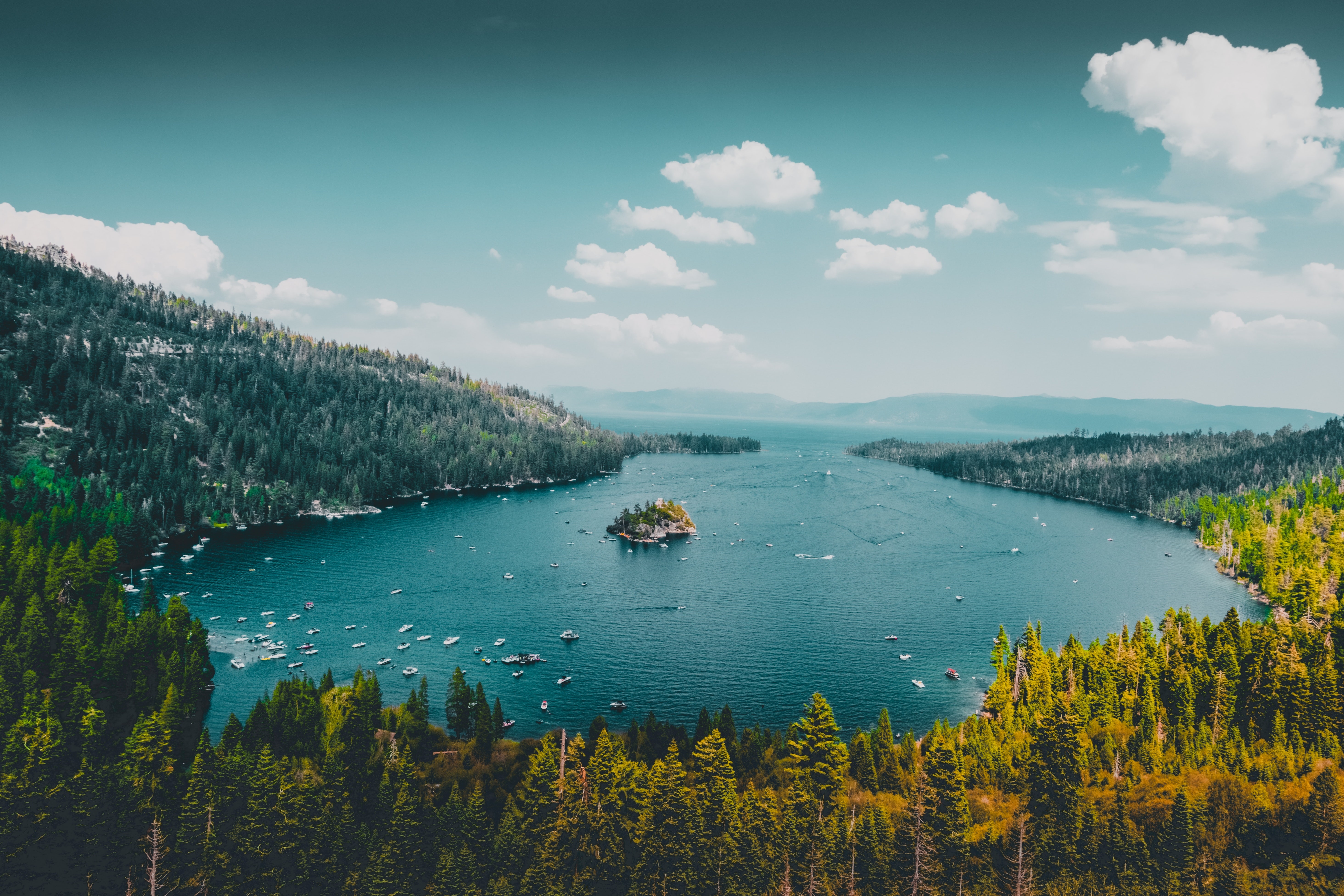 Stunning split view of Lake Tahoe showcasing its beauty in summer and winter